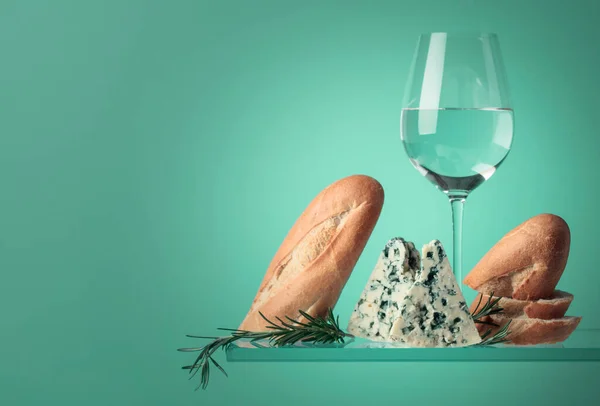 Blue cheese with bread, white wine and rosemary. Copy space for your text.