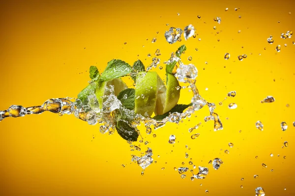 Fresh Lime Mint Ice Splash Yellow Background — Stock Photo, Image