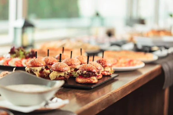 Burgers Stuffed Delicious Toppings Wooden Table Restaurant Selective Focus — Stock Photo, Image