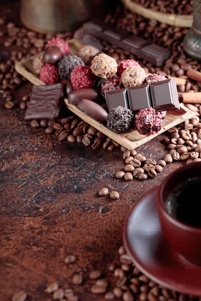 Various Chocolates Cup Black Coffee Sweets Cinnamon Sticks Coffee Beans — Stock Photo, Image