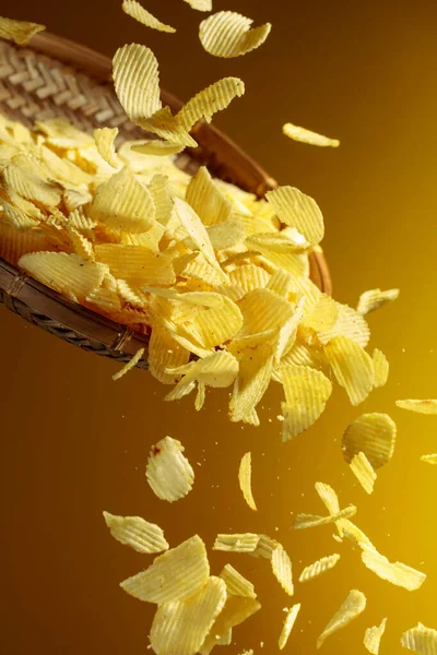 Falling Potato Chips Yellow Background Copy Space — Stock Photo, Image