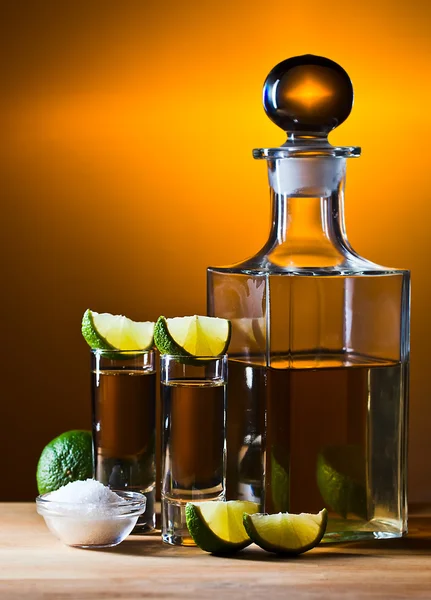 Gold tequila with salt and lime — Stock Photo, Image