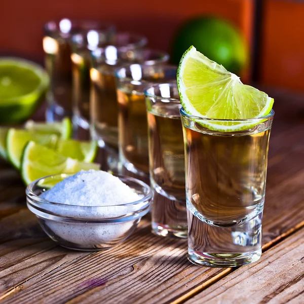 Gold tequila with salt and lime — Stock Photo, Image