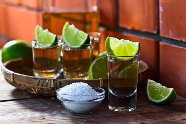 Gold tequila with salt and lime — Stock Photo, Image