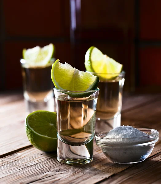 Gold tequila with salt and lime — Stock Photo, Image