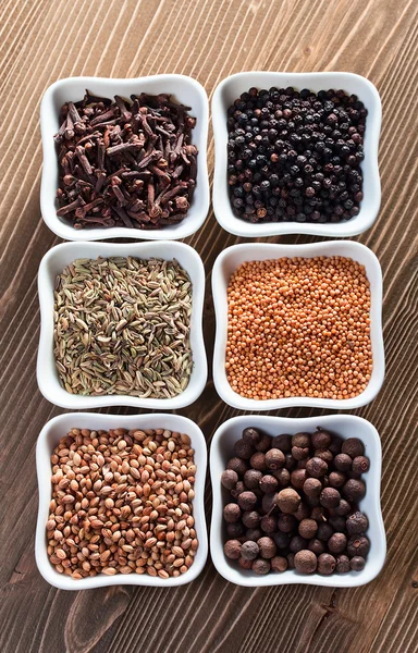 Spices on wooden table — Stock Photo, Image