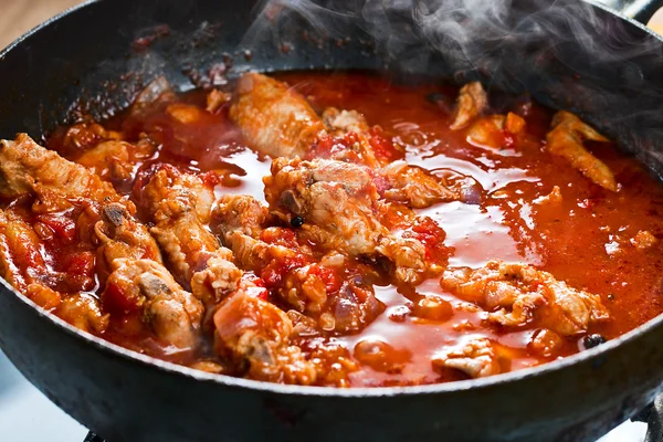 Stewed chicken in tomato sauce — Stock Photo, Image