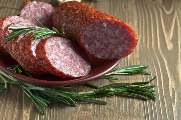 Salami with rosemary — Stock Photo, Image