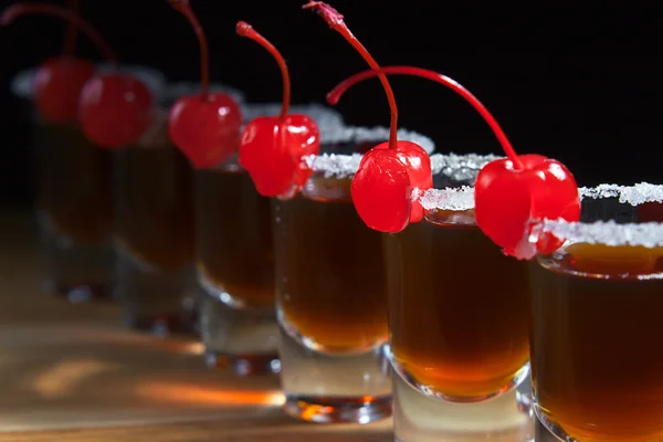 Alcoholic drink with cherries — Stock Photo, Image