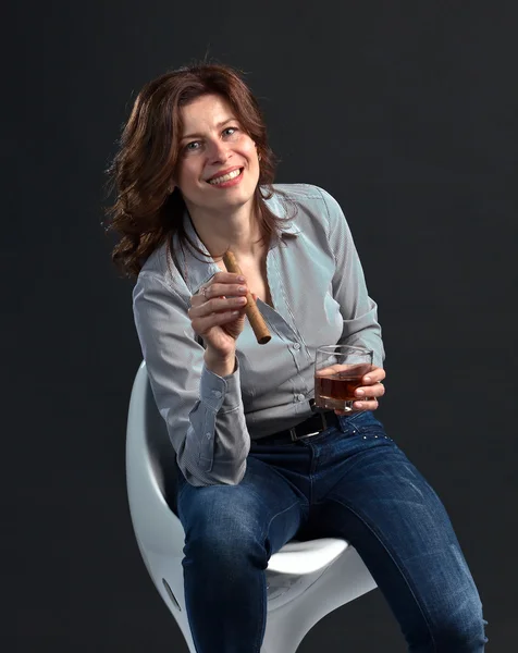 Middle aged woman with whiskey — Stok fotoğraf