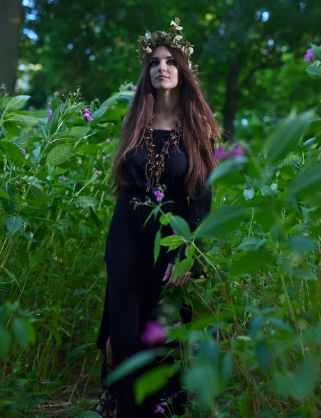 Witch in dark forest — Stock Photo, Image