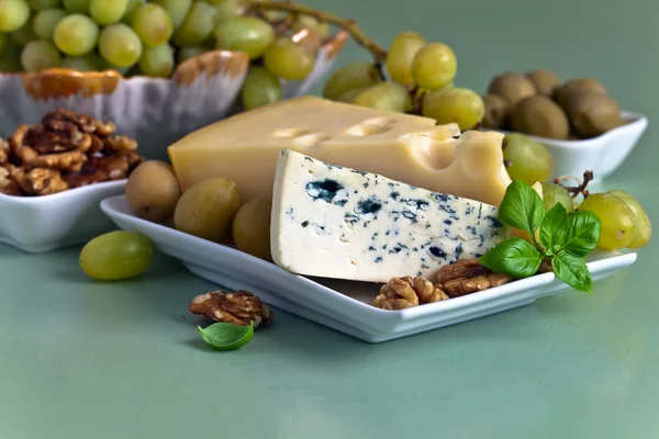 Cheese with nuts and olives — Stock Photo, Image