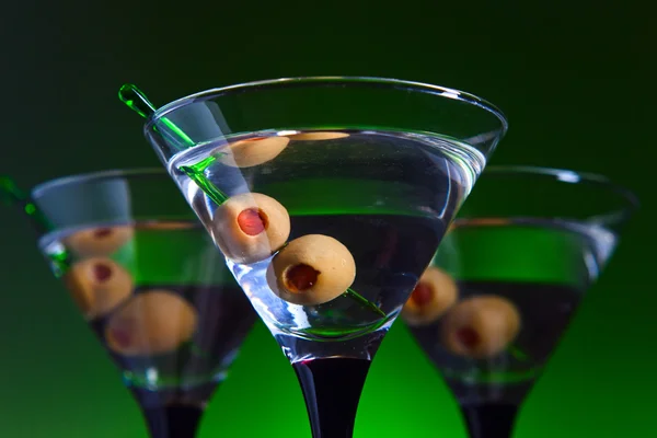 Glasses with martini and green olives — Stock Photo, Image