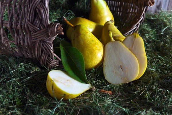 Yellow pears  in old basket — Stock Fotó