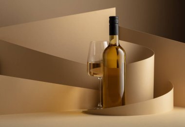 Bottle and glass of white wine on a beige background. Copy space.