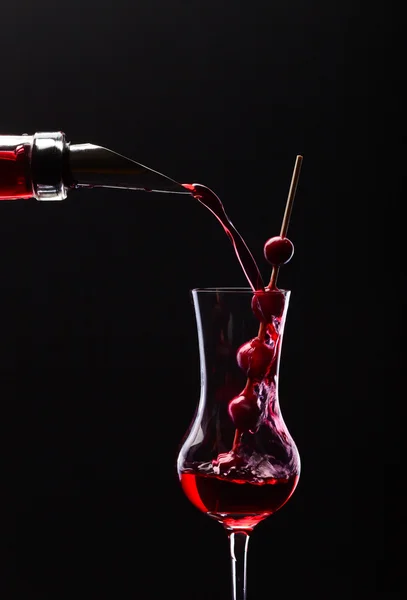 Cranberry liquor on black background — Stock Photo, Image