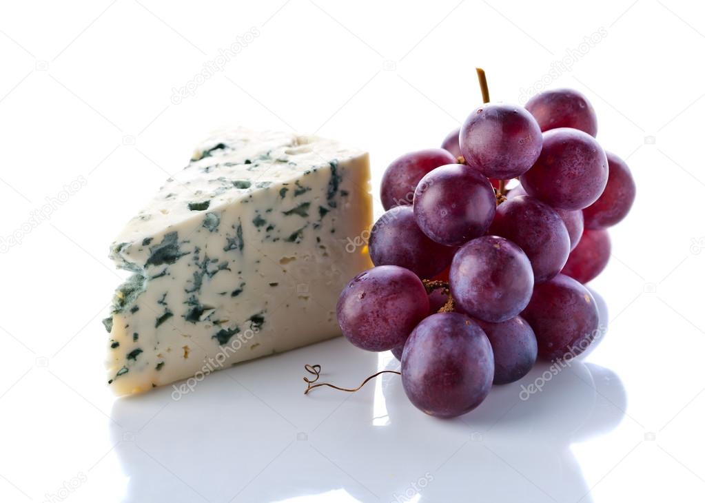 Gorgonzola and grape isolated on white