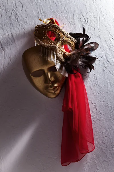 Venetian masks on  a old wall — Stock Photo, Image