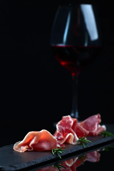 Jamon  on a black background — Stock Photo, Image