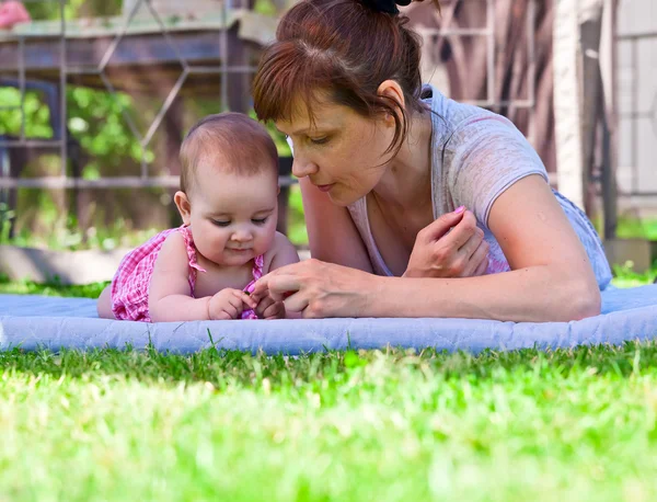 Middle aged woman with a little girl — Stock Photo, Image