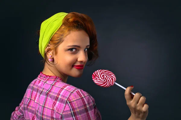 Young beautiful woman with candy — Stock Photo, Image