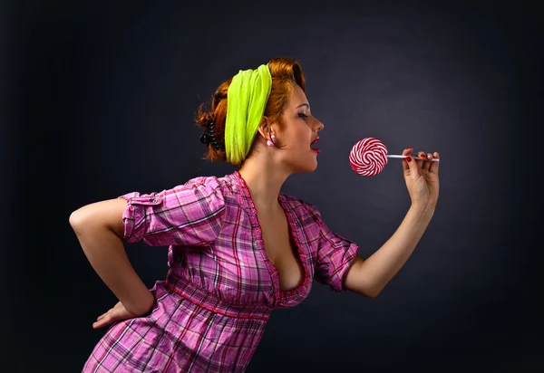 Young beautiful woman with candy — Stock Photo, Image