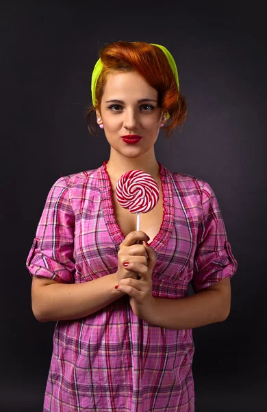 Young beautiful woman with candy — Stock Photo, Image