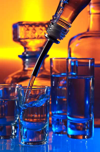 Vodka  on glass table — Stock Photo, Image