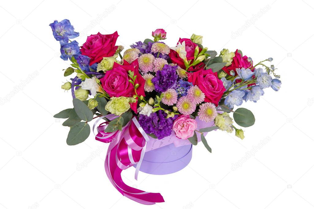 Cardboard box containing a flower arrangement with roses, chrysanthemums and leaves isolated on a white background