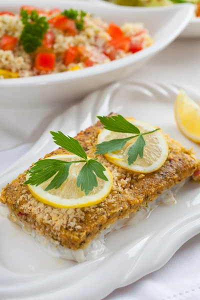 Baked fish fillet wih couscous salad — Stock Photo, Image