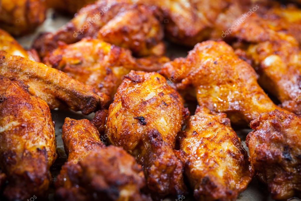 Chicken wings on baking sheet Stock Photo by ©brebca 67802543