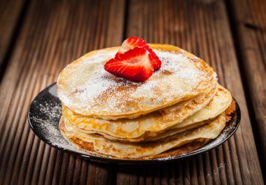 Crepes with fresh strawberries clipart