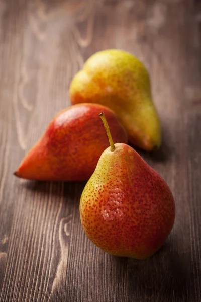 Pears on wooden table — Stock Photo, Image