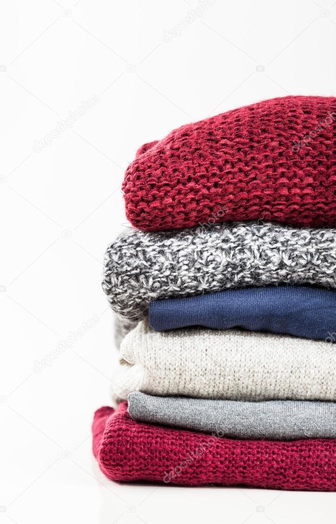 Stack of handmade wool sweaters