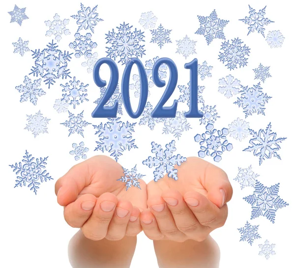 Flying snowflakes from womans cupped hands with 2021 text, Happy New year 2021, 2021 New Year greeting card, happiness luck health success concept, isolated on white background, 2021 greeting card concept