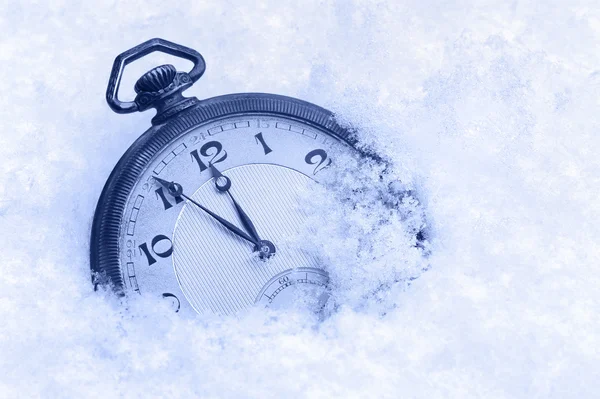 Pocket watch in snow, Happy New Year greeting card Stock Picture