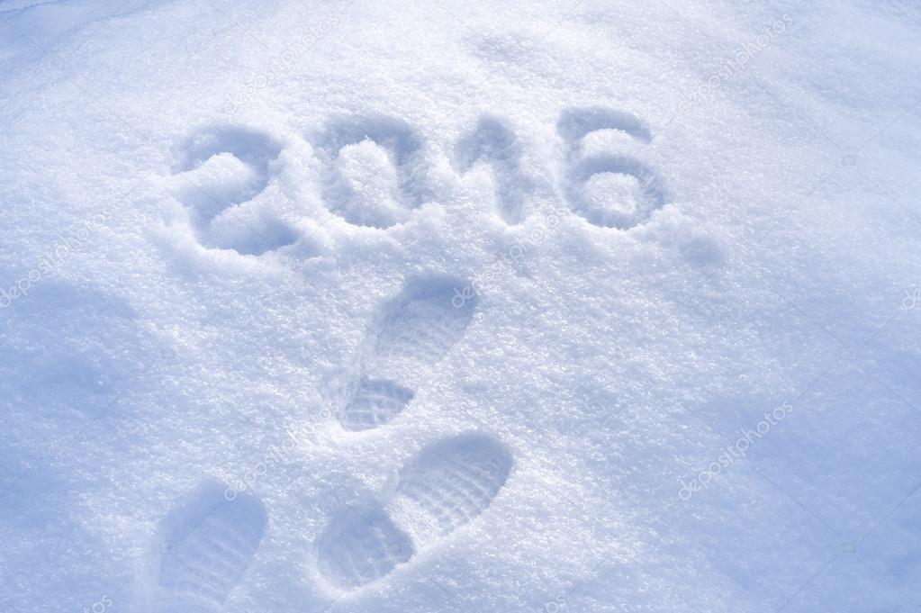 Foot step prints in snow, New Year 2016 greeting