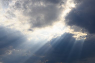 clouds on sky with sun rays clipart