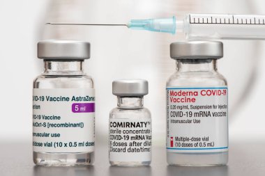 original vials with vaccine against covid-19 virus clipart