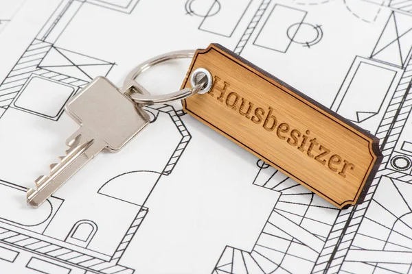 house key laying in construction plan