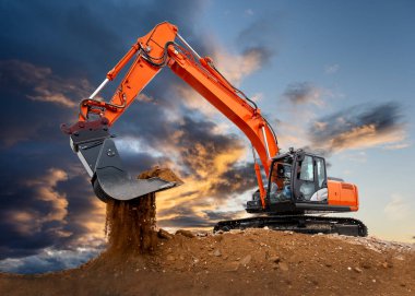 excavator working on construction site with dramatic clouds on sky clipart