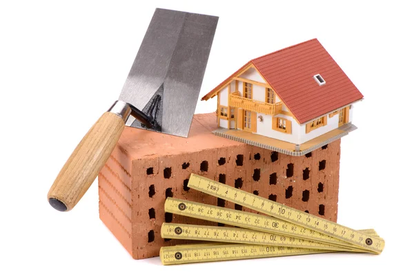 Brick and tools for house construction — Stock Photo, Image