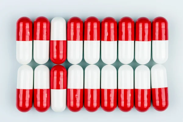 Red and white capsules — Stock Photo, Image