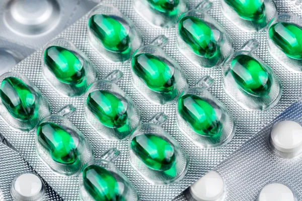 Blister full of green pills — Stock Photo, Image