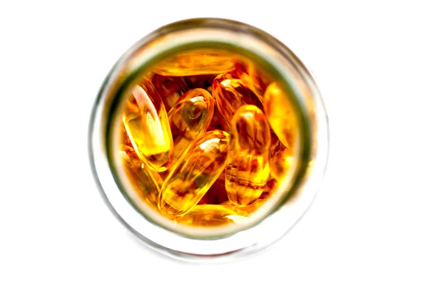 Yellow pills in the jar — Stock Photo, Image