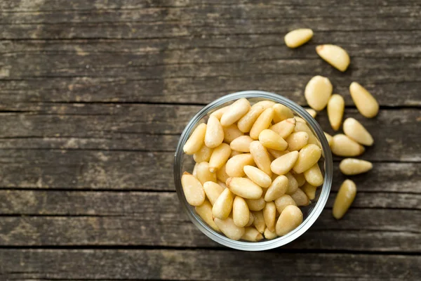 Pine nuts in bowl — Stock Photo, Image