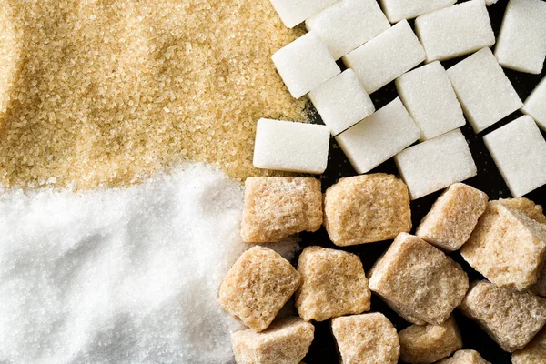 Unrefined cane and white sugar — Stock Photo, Image