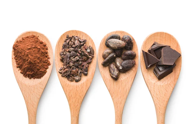 Cocoa and dark chocolate in wooden spoons — Stock Photo, Image