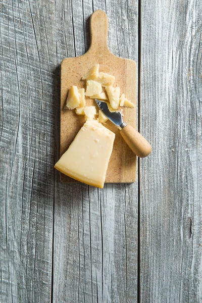 Parmesan cheese with knife — Stock Photo, Image