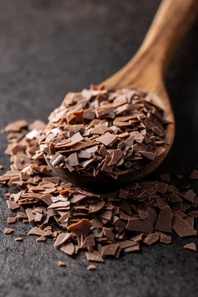 Grated Dark Chocolate Chocolate Flakes Wooden Spoon Black Table — Stock Photo, Image